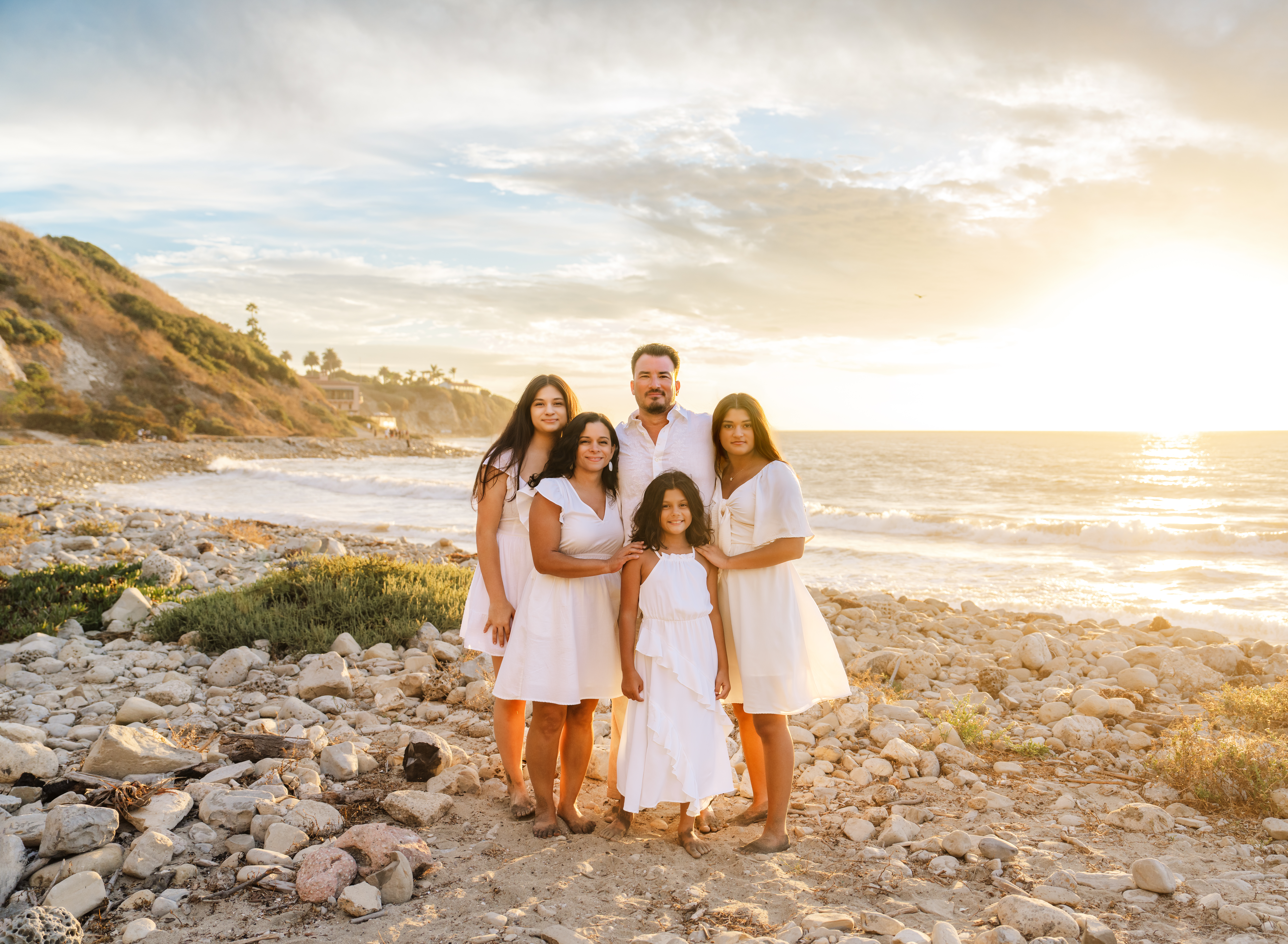family at the beach taking photos with los angeles family photographer, Emily Winnie