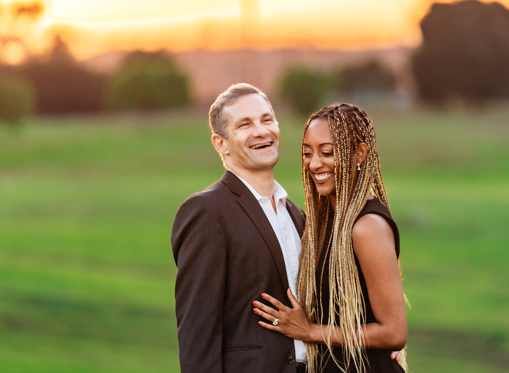 A middle-aged couple in formal attire taking Los Angeles Engagement Photos with Emily Winnie.