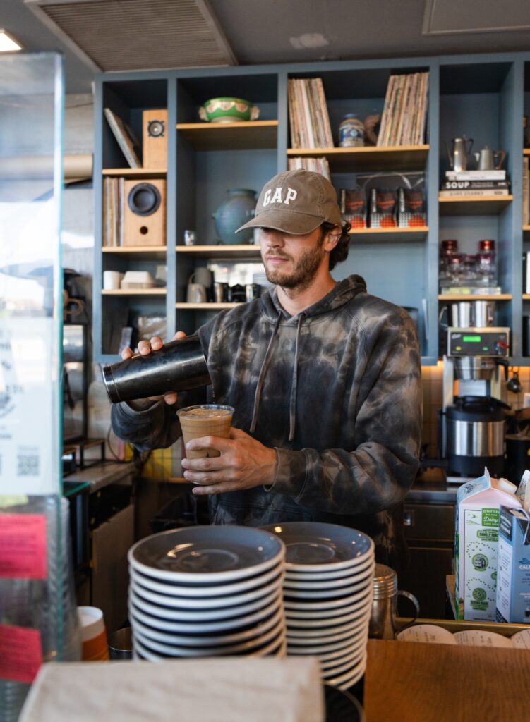 “Culver City Photographer, Emily Winnie, visits Mill Cross Coffee as a barista makes her coffee”