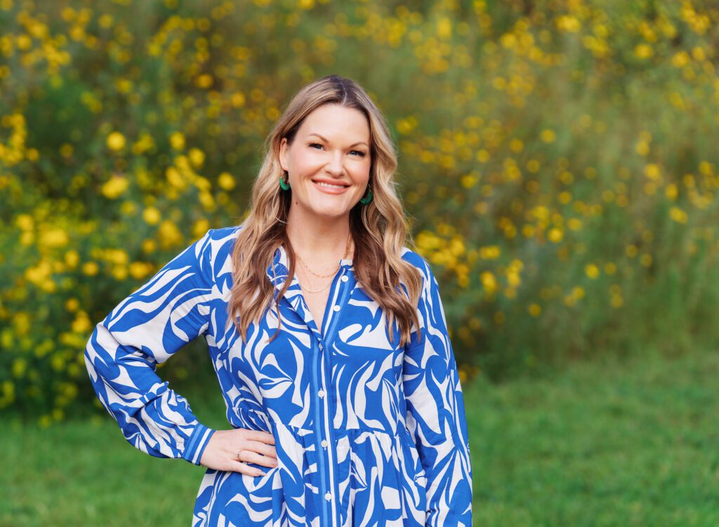 Branding photo of a woman in a blue and white dress in front of yellow spring flowers with Culver City headshot photographer, Emily Winnie.