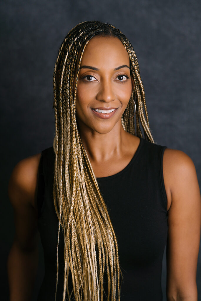 Headshots of a young female in a black tank top against a dark gray backdrop with Emily Winnie Photography.