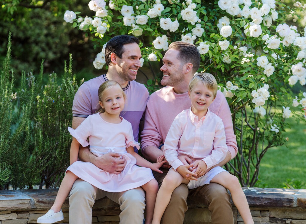 Children smiling naturally during an outdoor Los Angeles family session