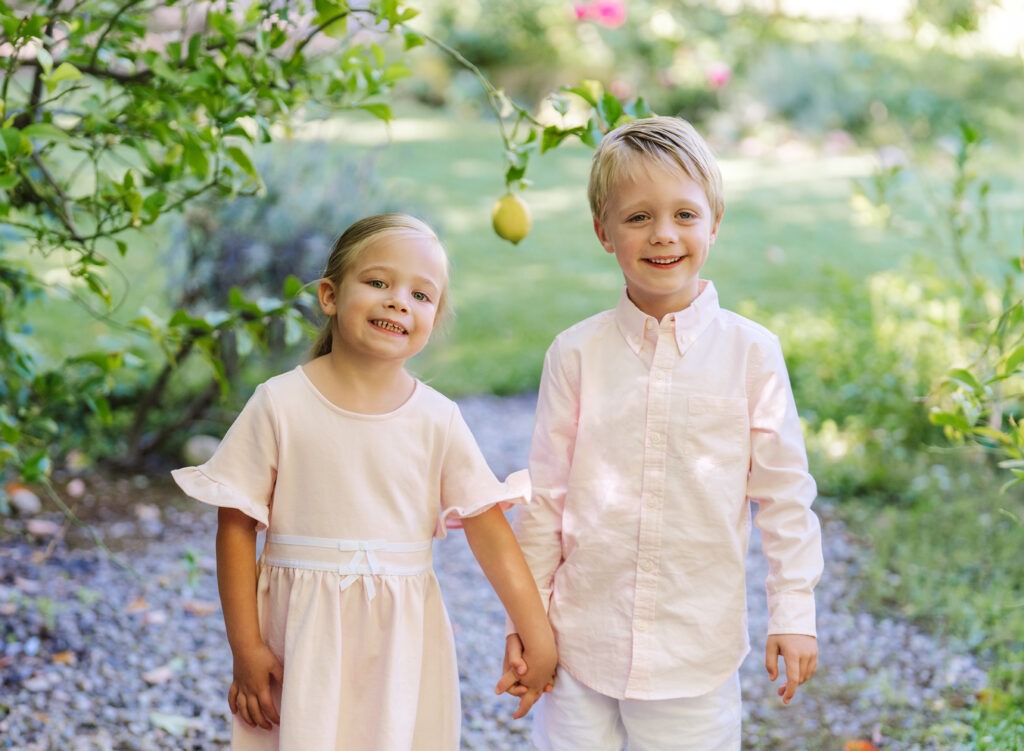 Young child standing on the grass at a Westside family portrait sessio
